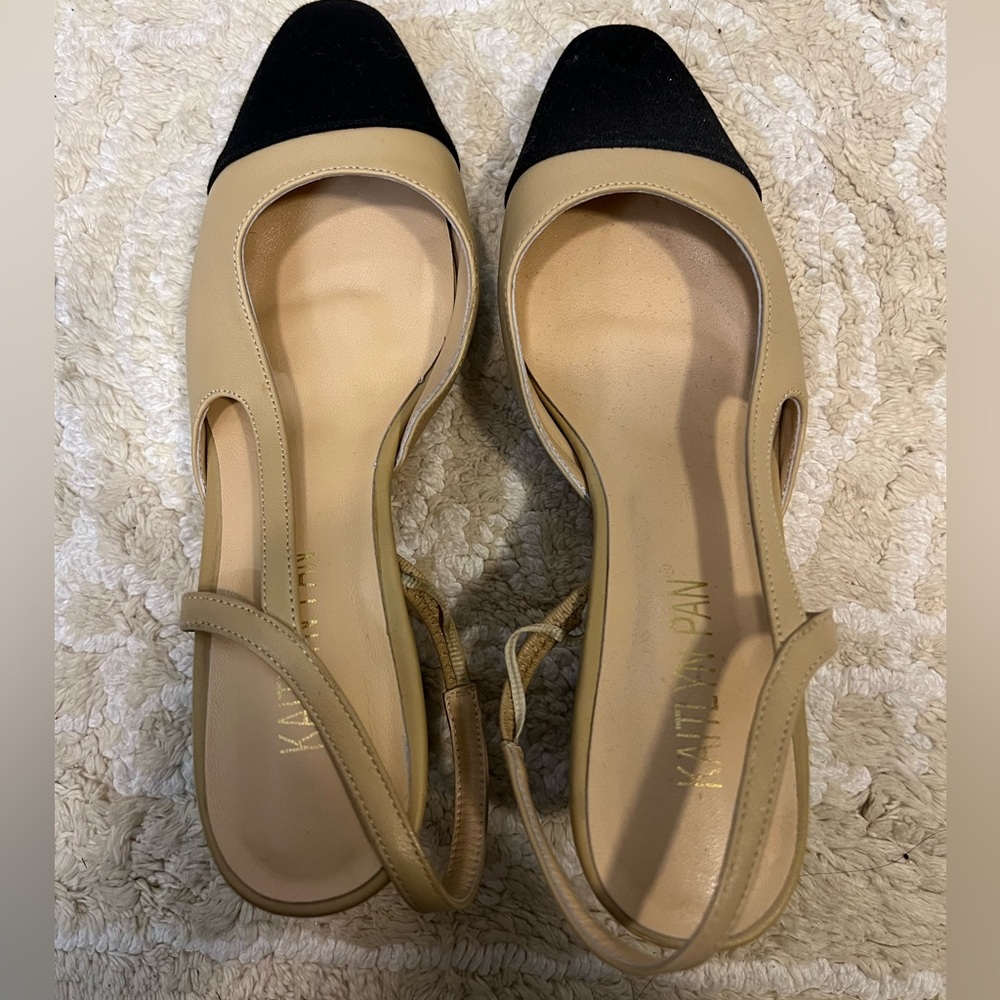 Nude and black leather sling back heels